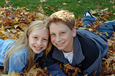 Kids In Leaves